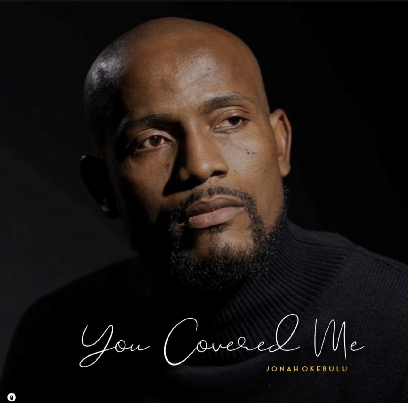 Cover art for “You Covered Me” by Jonah Okebulu: a dark portrait of Jonah in a black sweater with the title in script.